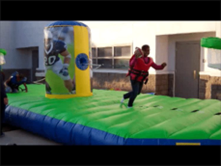 Kid playing the inflatable bungee challenge