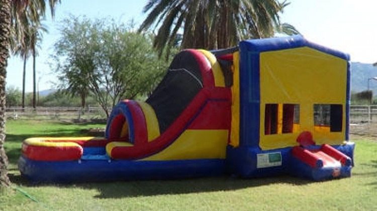 Bounce house with attached slide