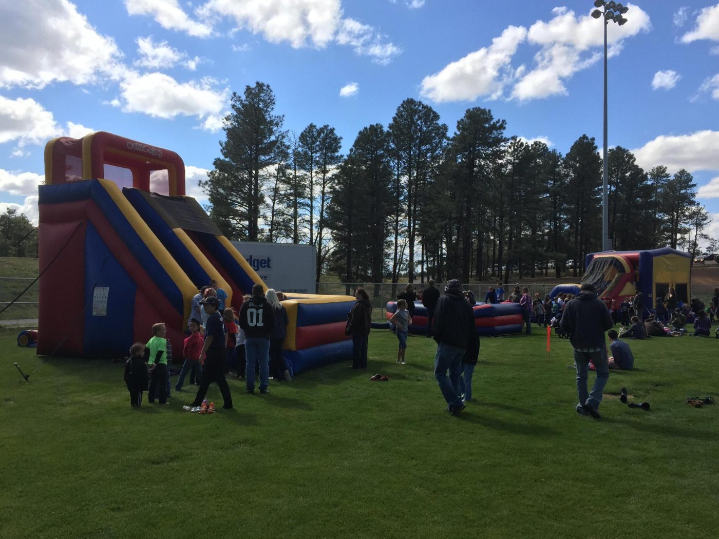 Big slide and bounce houses at a community event