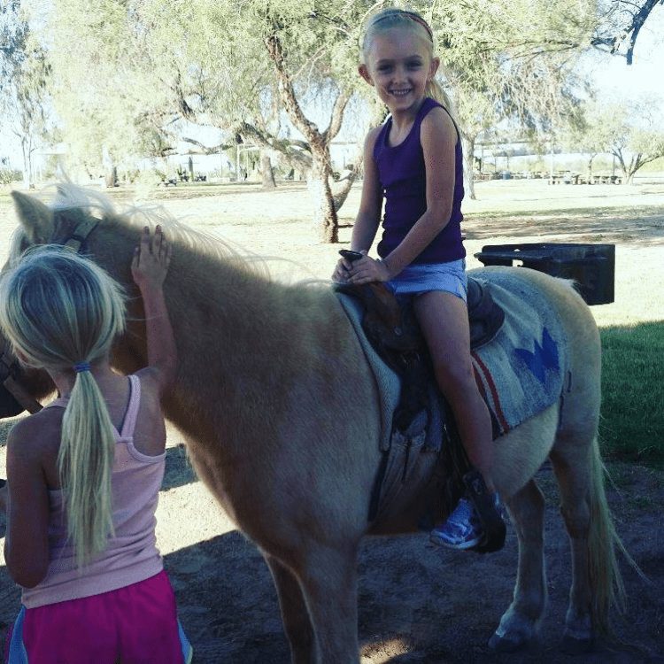 Girl riding a pony
